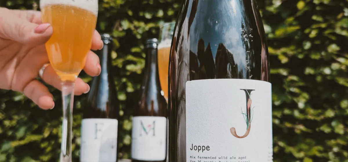 Wild ale Joppe from Zomerdijk Brewing & Blending with poured glass, part of the 9Y Summer Release
